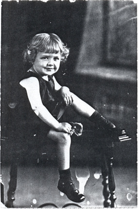 Young girl sitting in chair