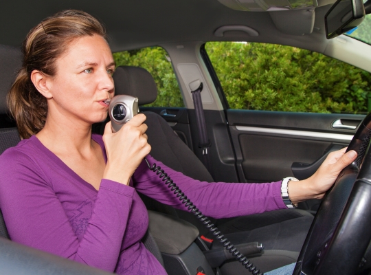 Lady with the breathalyzers in a car