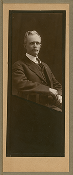 Studio portrait of seated man, Commissioner John Henry Rodgers, circa 1910.
