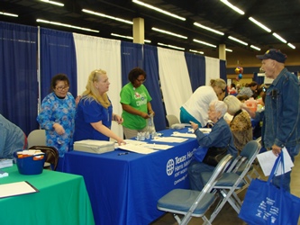 Photo of THR Booth assisting attendees