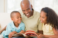 Dad and kids reading