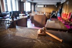 gavel with courtroom in background